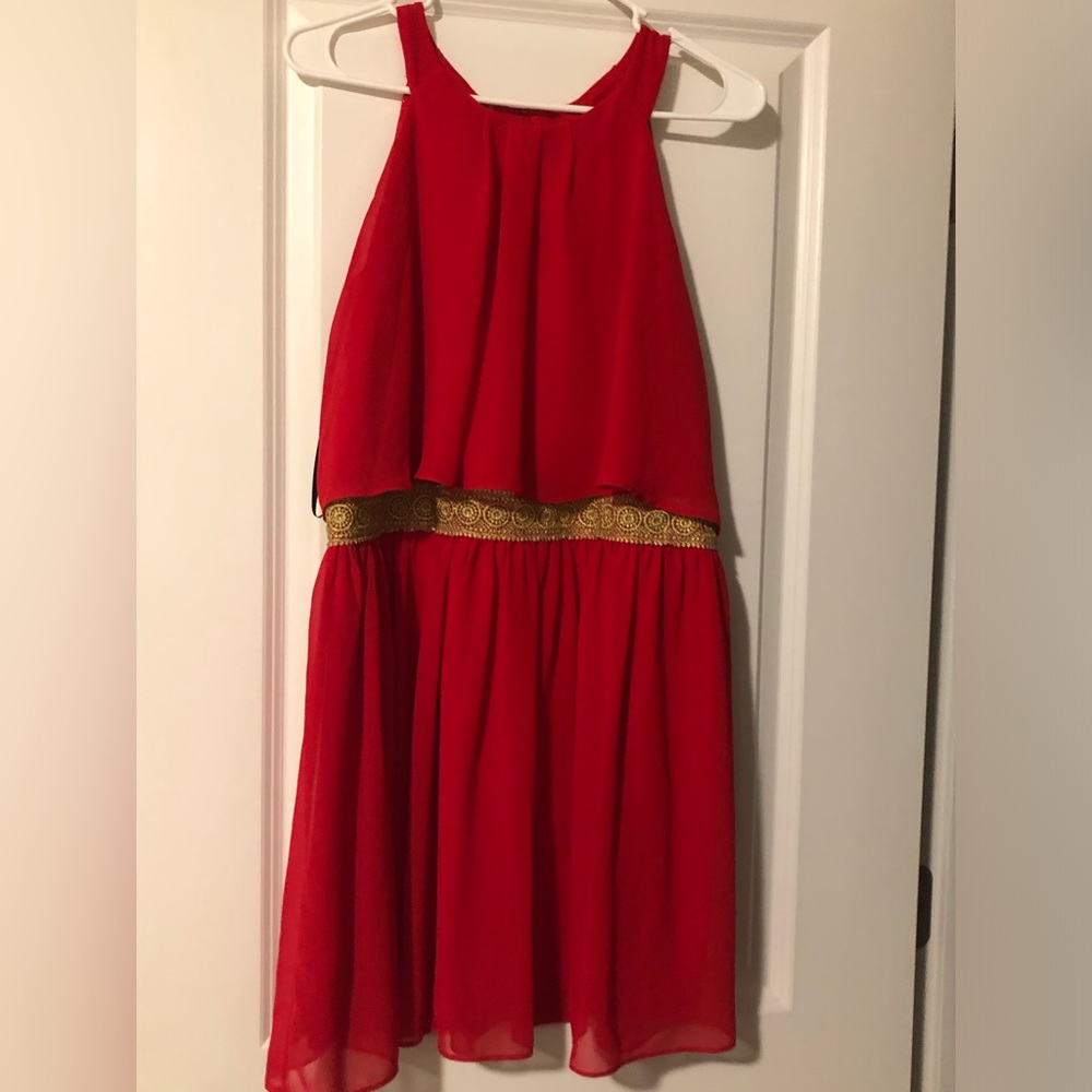 Red layered dress with gold accent belt